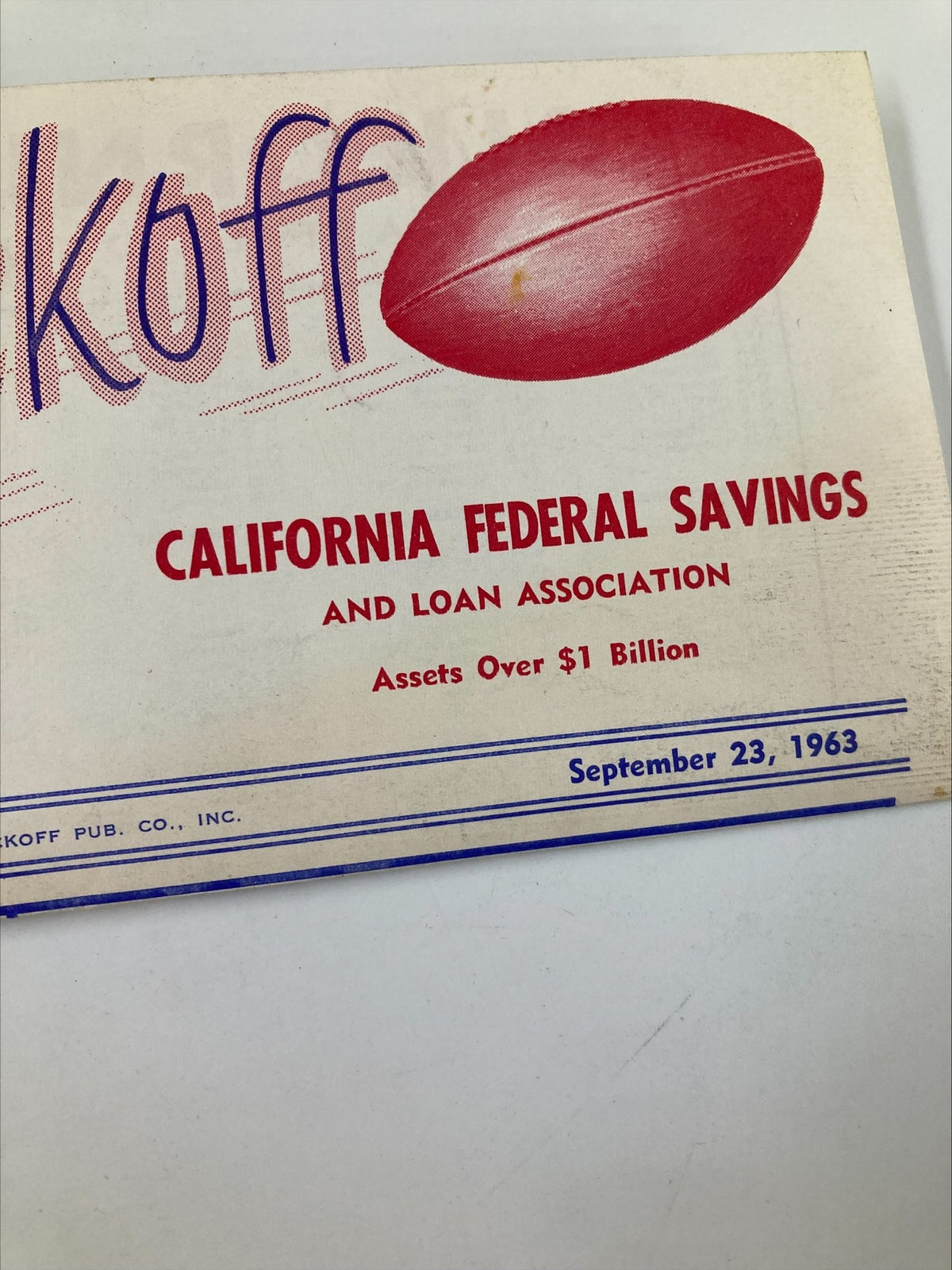 September 23, 1963 NCAA Football California Federal Savings The Kickoff Program back cover displaying a red football and details about California Federal Savings, highlighting its historical significance.