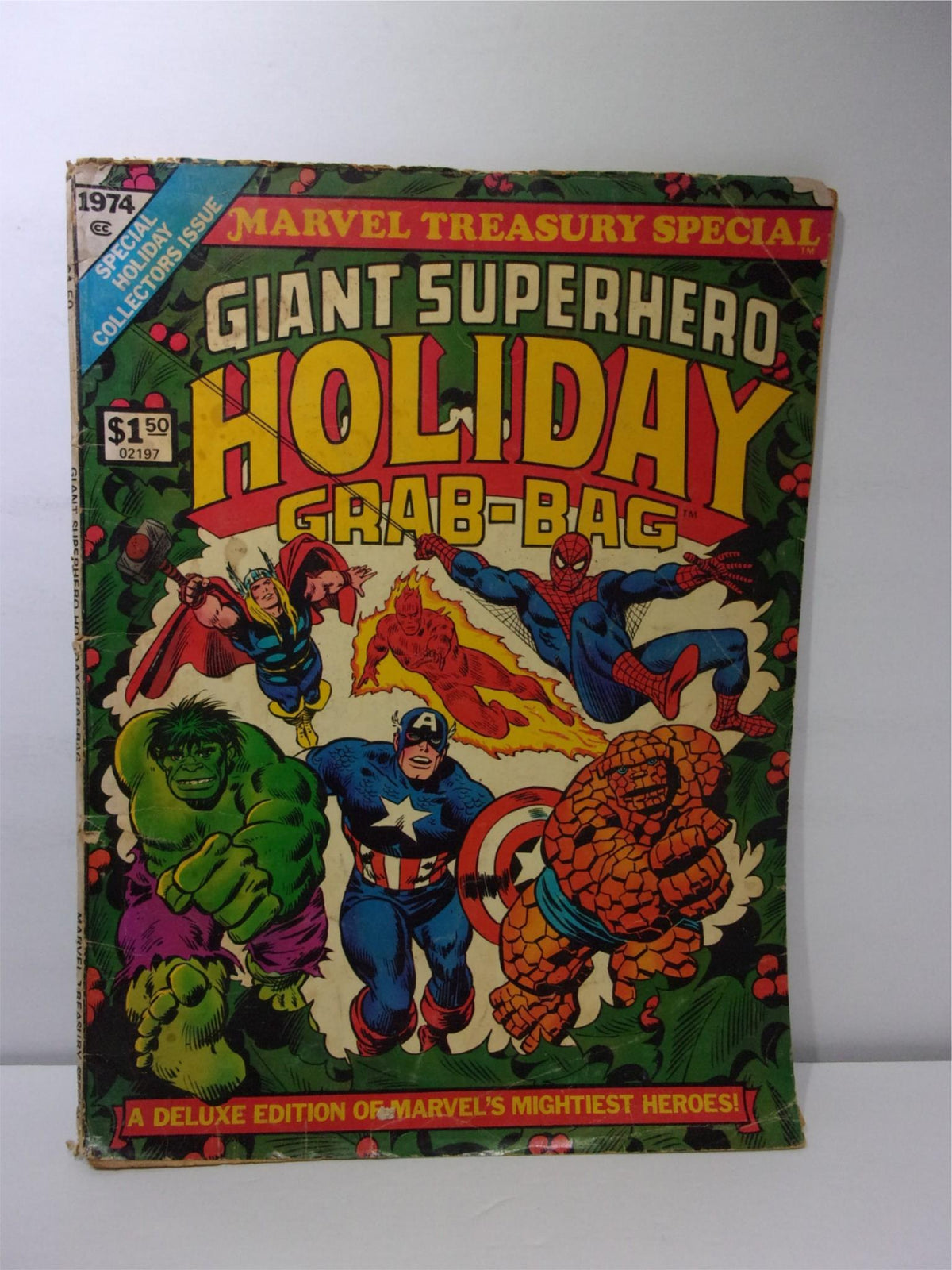 1974 Marvel Treasury Special Giant Superhero Holiday Grab-Bag featuring iconic superheroes on the vibrant cover, highlighting Spiderman, Captain America, Hulk, and others amidst a festive design.