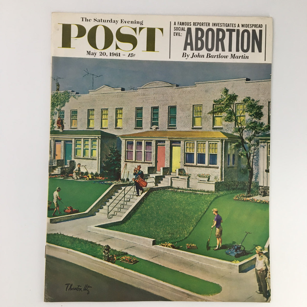 The Saturday Evening Post May 20, 1961 cover illustrating suburban life, featuring an article titled 'Abortion' by John Bartlow Martin, showcasing people tending to lawns and vibrant homes.