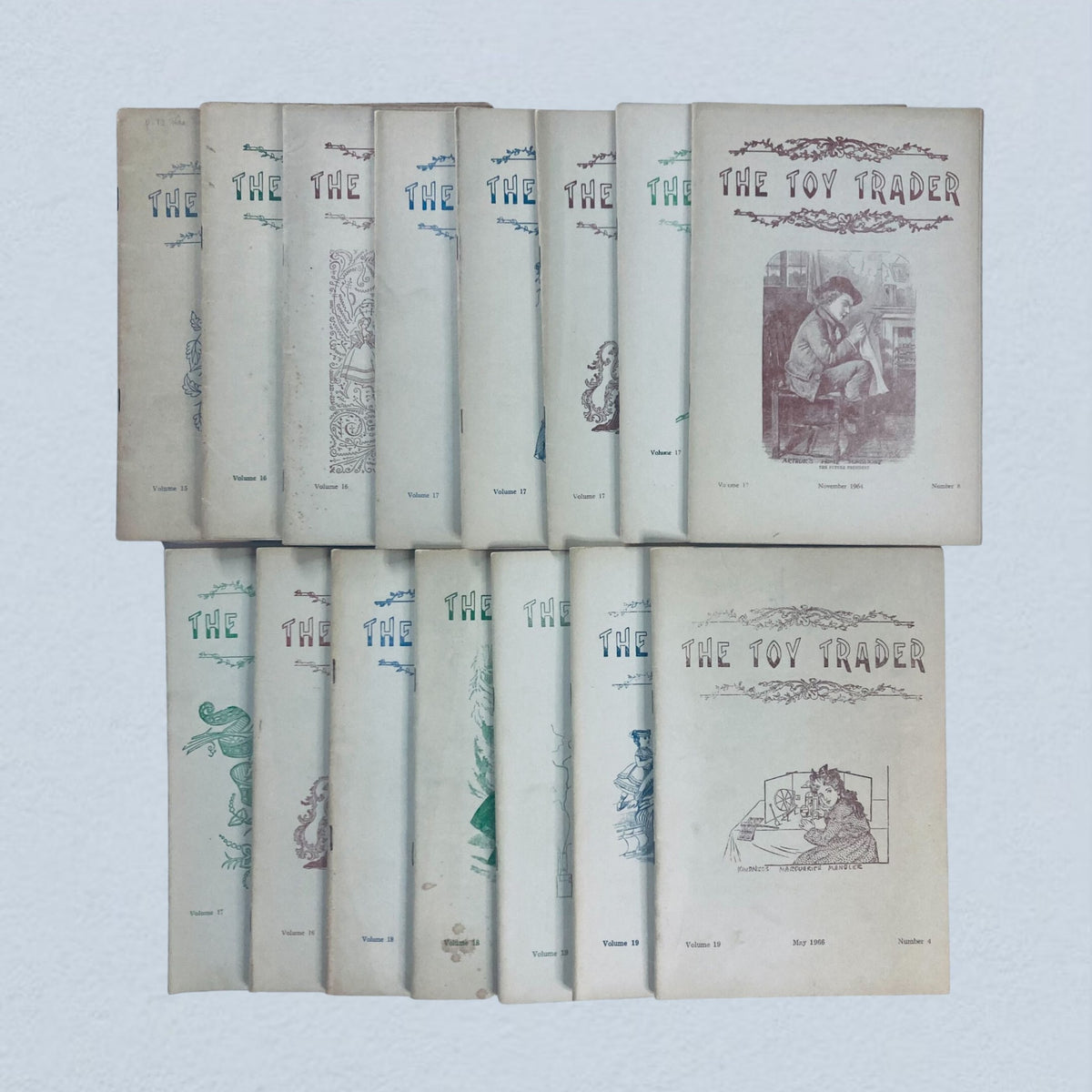 Lot of 15 1960s The Toy Trader Magazine - a collection of vintage doll collector magazines displaying various covers and volumes from the 1960s.