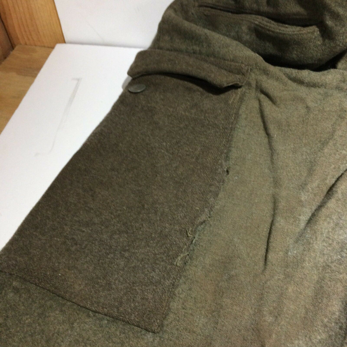 Side pocket detail of Vintage Swedish army military hunting cargo pants, highlighting material and stitching.