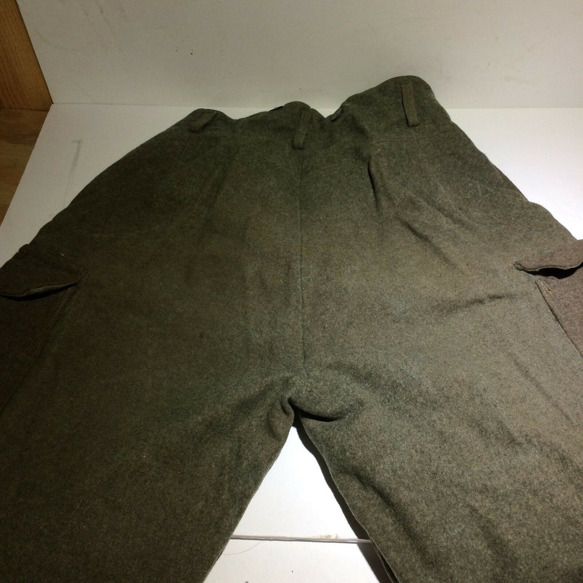 Back view of Vintage Swedish army military hunting cargo pants, showcasing the overall structure and pockets.