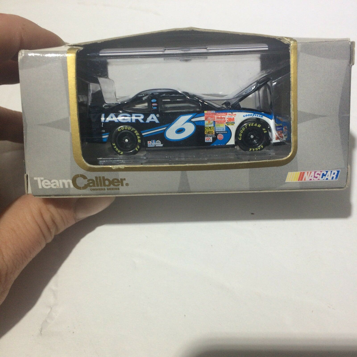 Team Caliber 2003 Limited Edition Mark Martin #6 "Viagra" 1:64 Die-Cast model displayed in its original packaging, showcasing authentic details and precision craftsmanship.