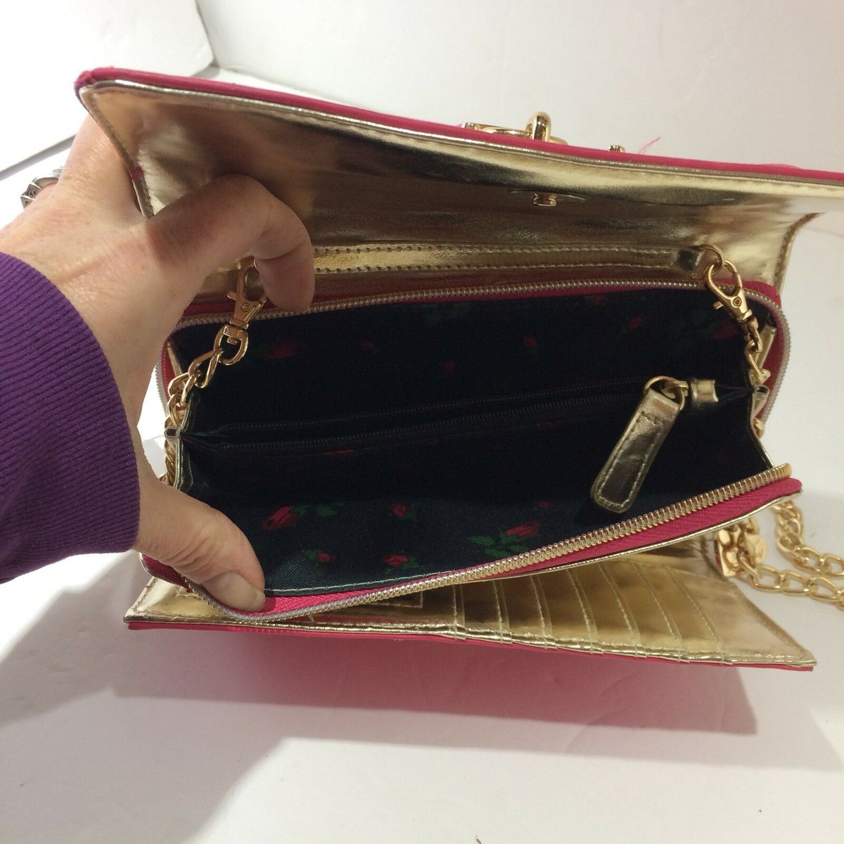 Open view of Betsey Johnson Pink & Gold Chain Purse Bag Quilted Heart Lock Bow Lipstick revealing spacious interior with zip pocket.