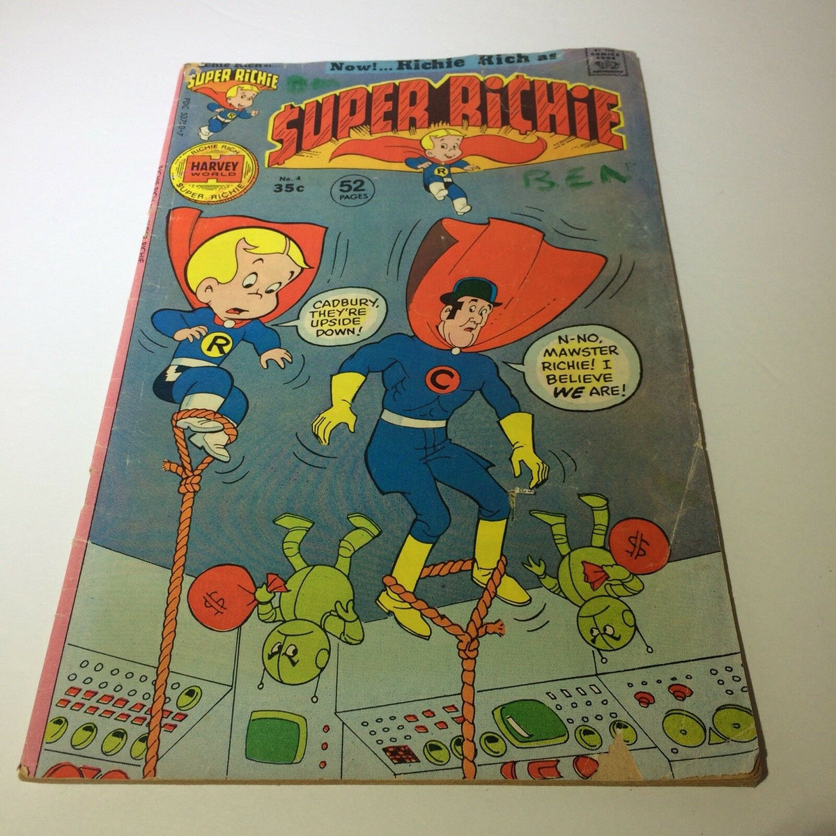 Super Richie #4 Collectible Vintage Comic from Harvey World showing cartoon characters on the front cover. Features colorful illustrations and signs of wear including a name written on the cover, a small tear, and a worn back cover.