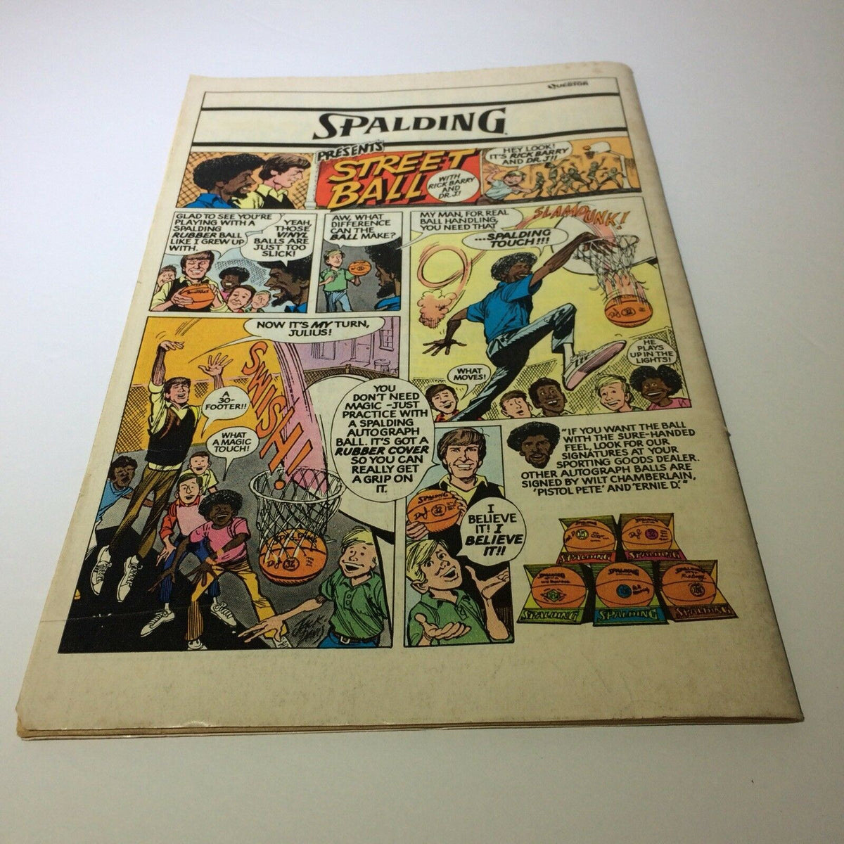 Back cover of Marvel Comics YOGI BEAR #1, featuring advertisement content for Spalding basketball and an illustration of kids playing street ball.