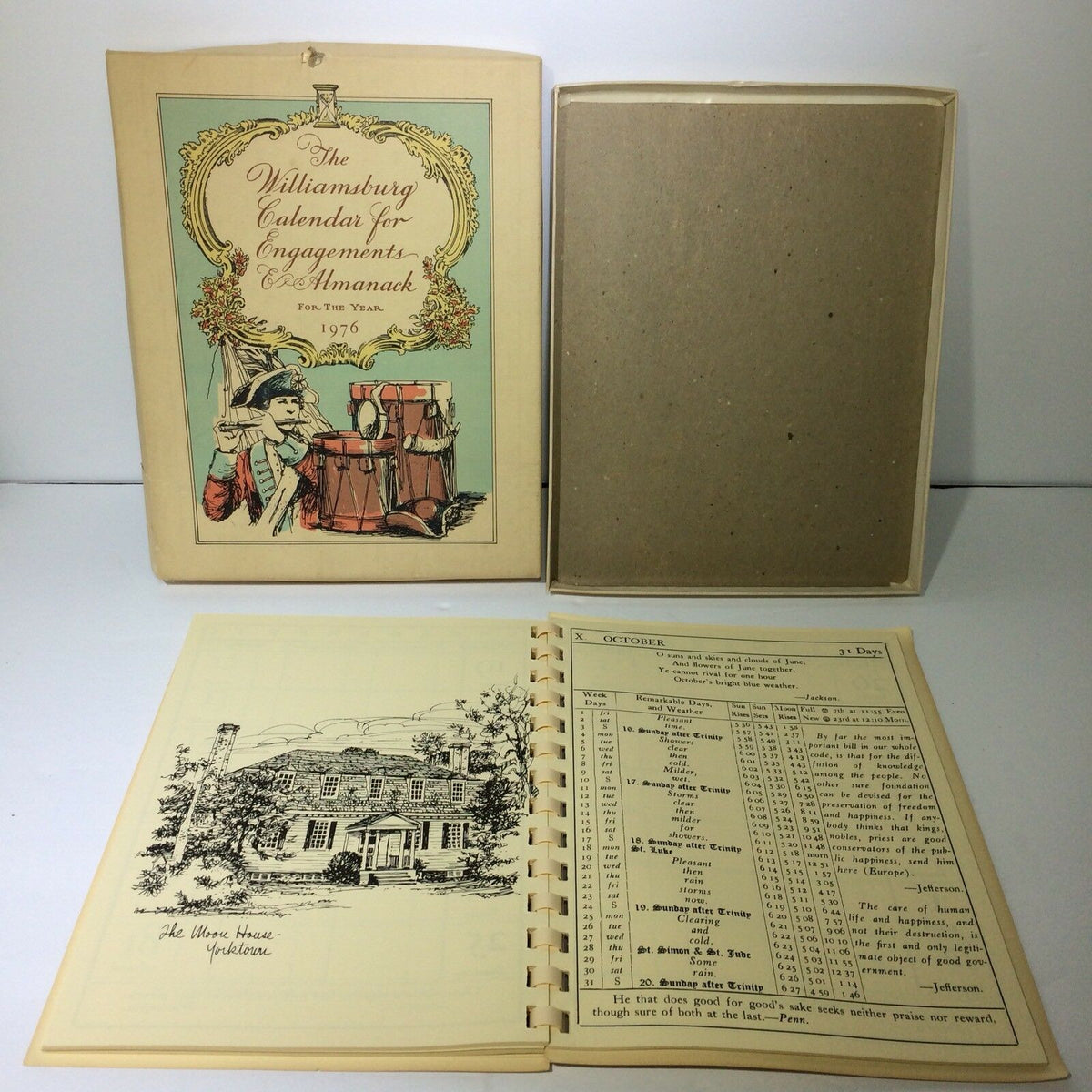 Vintage 1976 Williamsburg Calendar & Almanack featuring an illustrated cover showing colonial figures with drums and a flute, inside an original protective box. Perfect for collectors of vintage magazines.