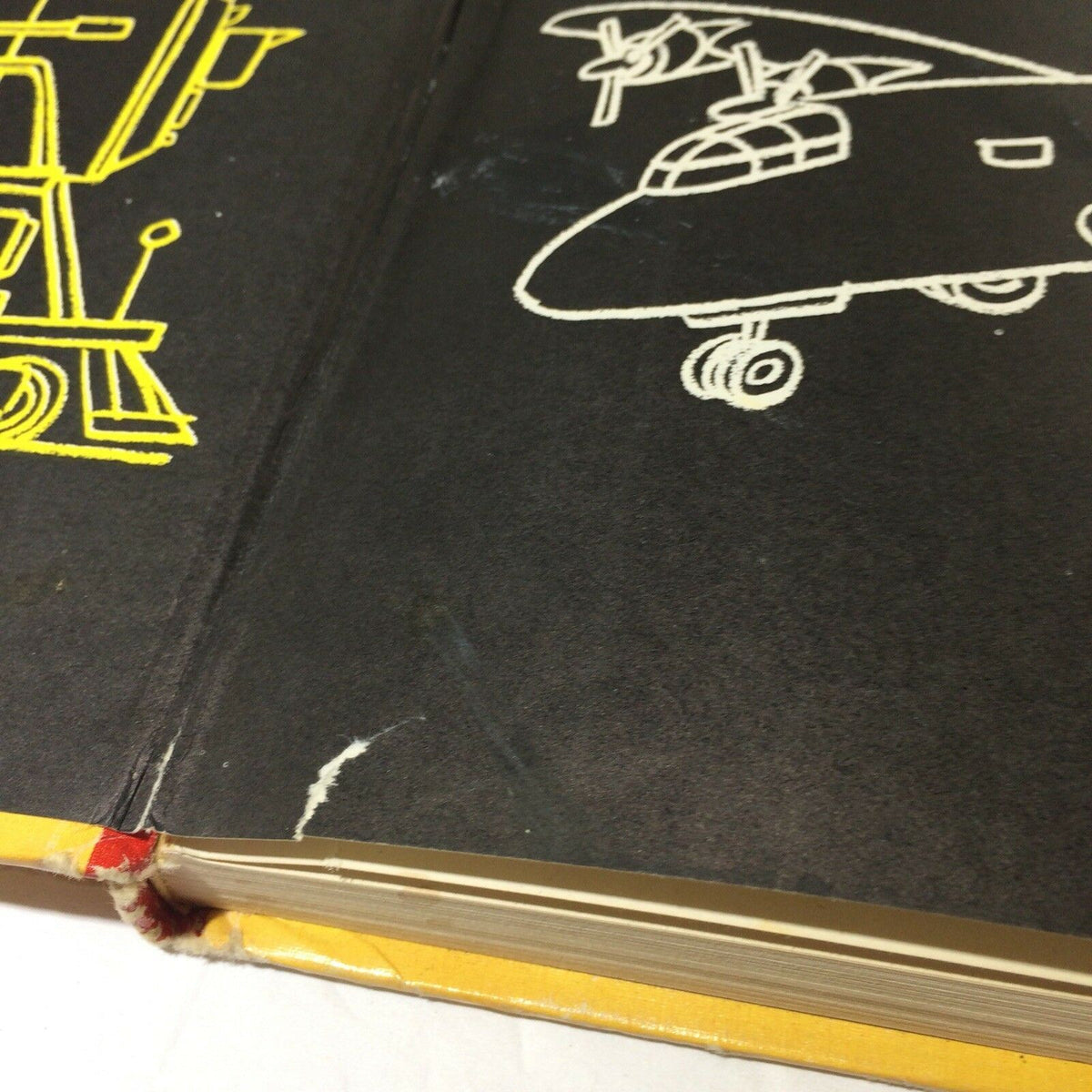 Detail of the spine of The Giant Nursery Book of Things That Go by George Zaffo, highlighting wear and tear on the book's cover.