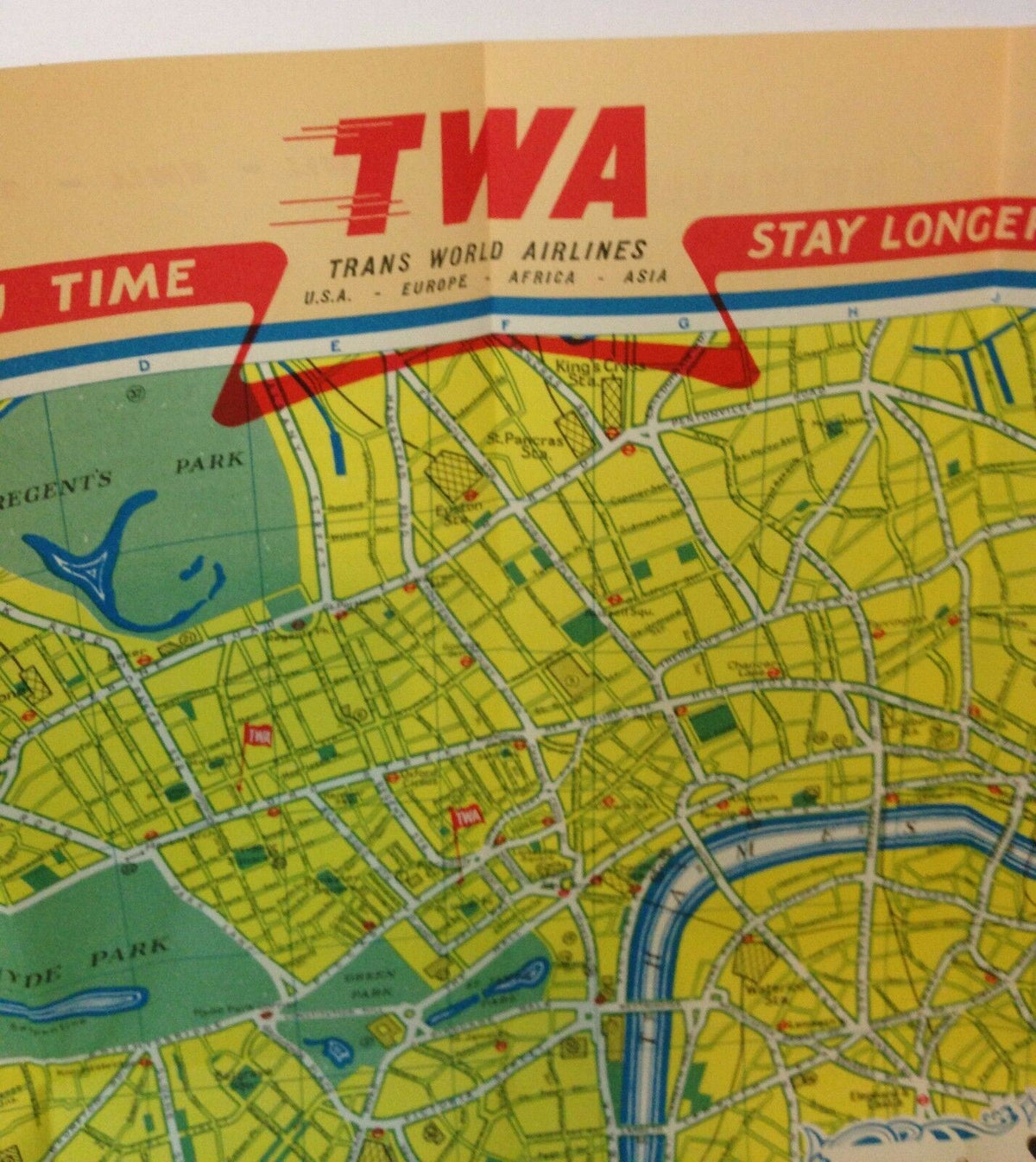 Close-up of the Vintage 1953 TWA Trans World Airlines illustrated city map of London, England, emphasizing the branding of TWA and navigational aids for travelers.