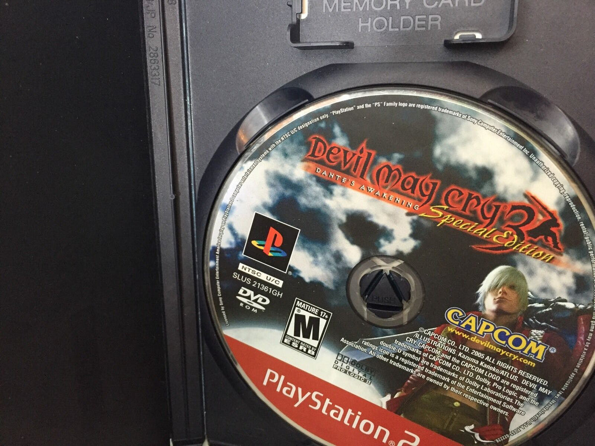 Close-up of the disc for Devil May Cry 3 Dante's Awakening Special Edition for PlayStation 2, included in the collection 4 Devil May Cry 3 Dante's Awaken Transformers Shadow Hedgehog Lego star wars Ps2.
