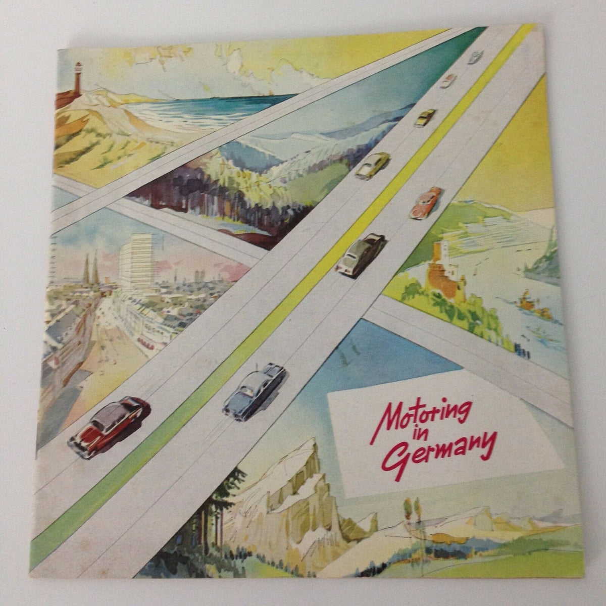 Vintage 1950s Guide Booklet to Motoring in Germany featuring a colorful illustrated cover with scenic landscapes and classic cars on the open road.