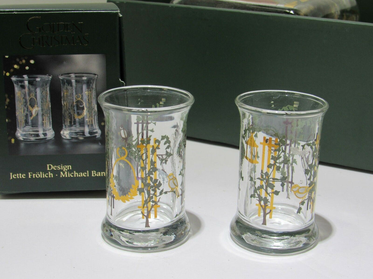Two elegant dram glasses from the Holmegaard CHRISTMAS Juleflaske set, featuring decorative elements perfect for holiday celebrations.