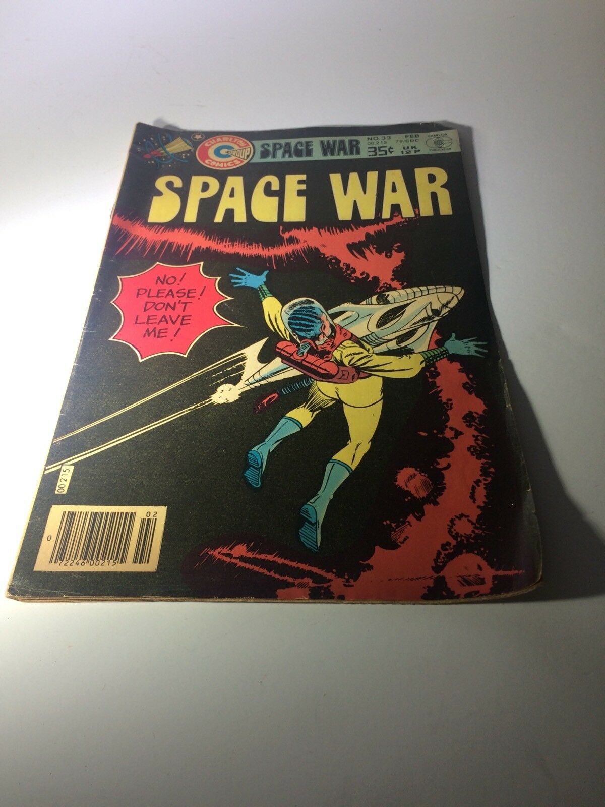 Cover of Space War Comic Book #33 by Charlton Group, featuring a dramatic illustration of an astronaut in distress against a vibrant space background.