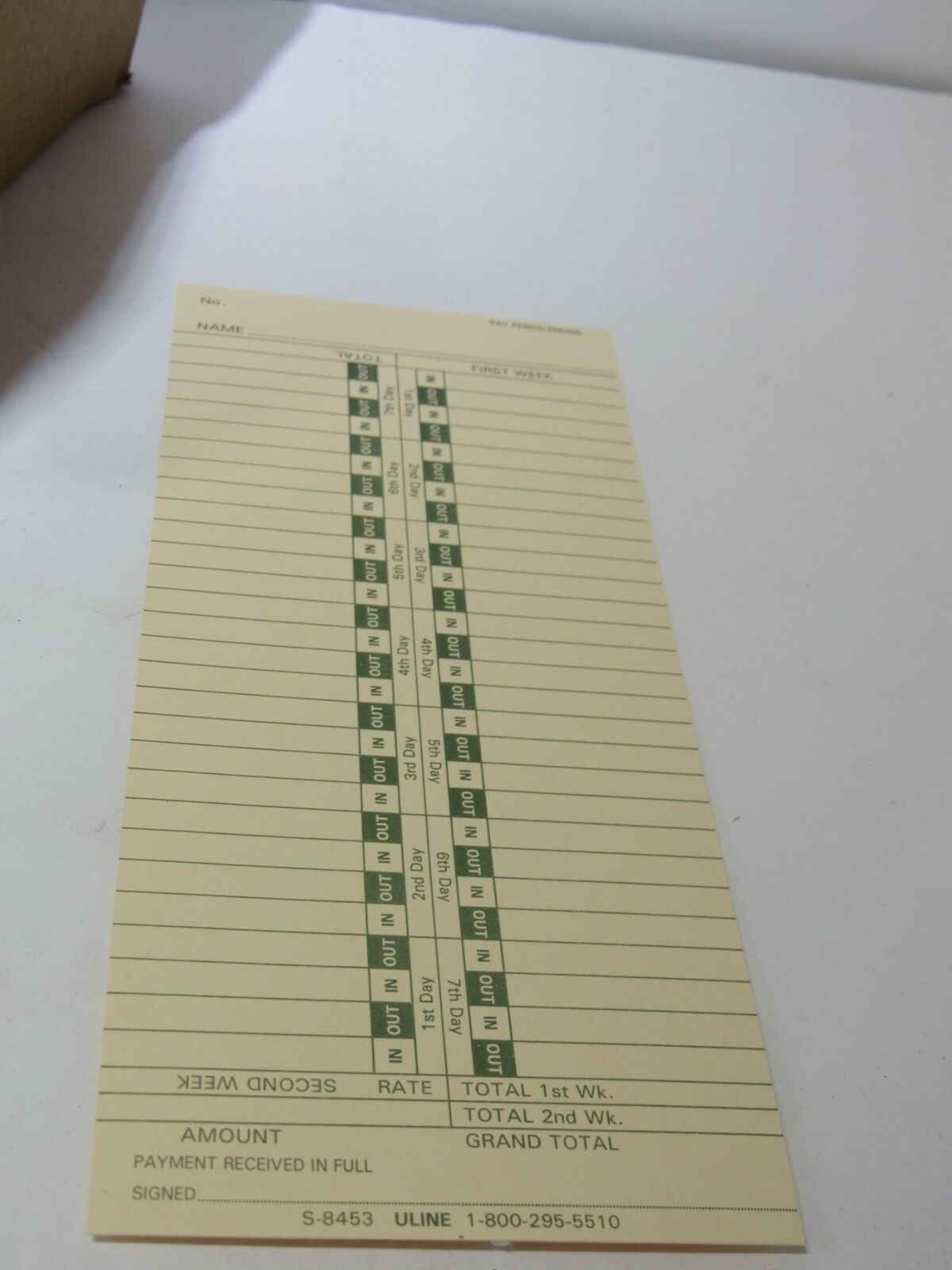 Close-up of a ULINE Bi-Weekly Time Card S-8453, featuring sections for recording name, hours worked, and total payments.