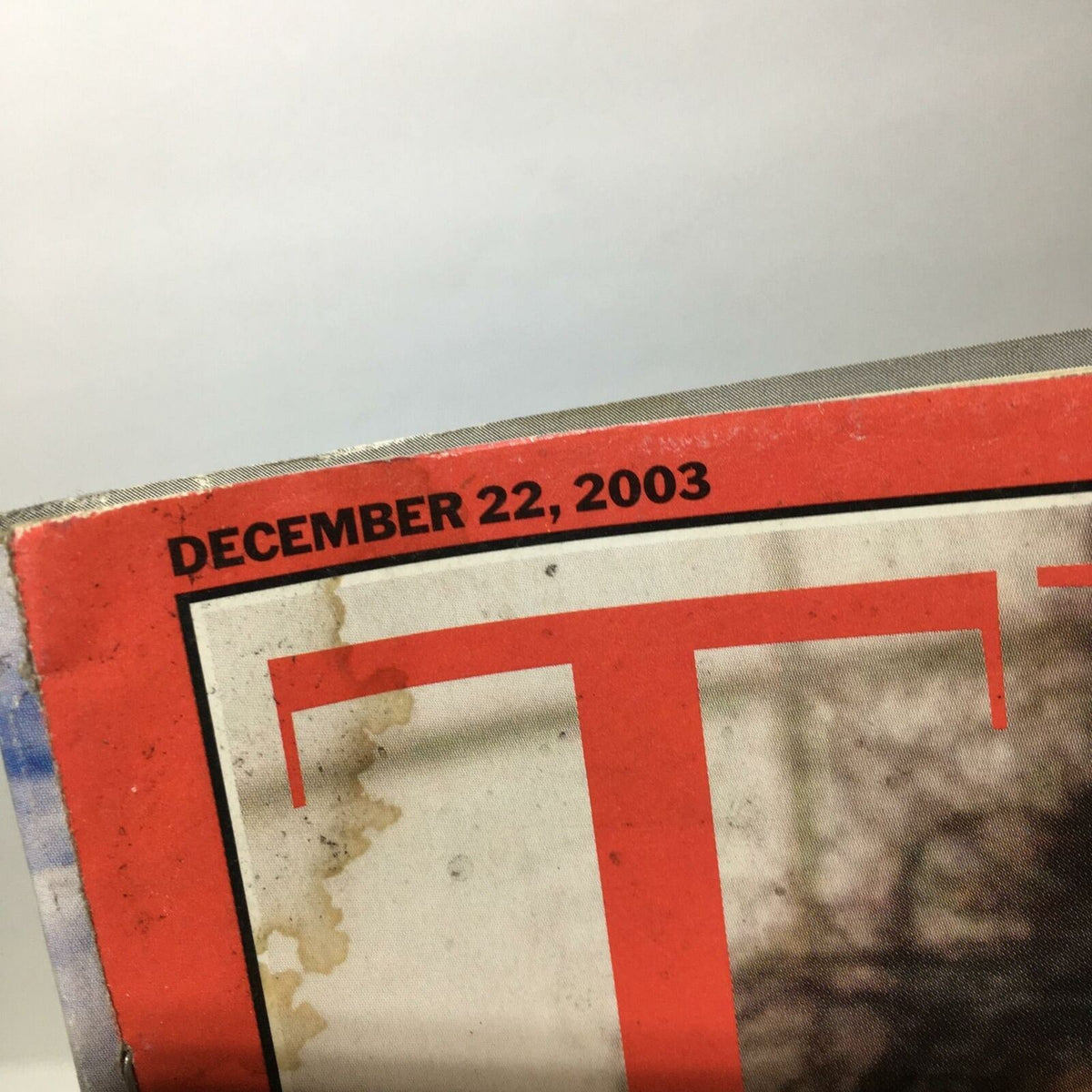 Time Magazine December 22 2003 headline showing the date, featuring the iconic issue 'We Got Him! Saddam Hussein'.