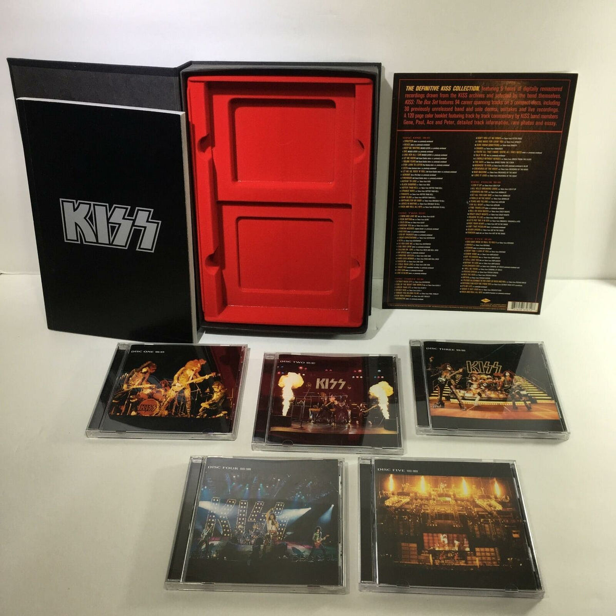 Definitive Kiss Collection 5 Disc Box Set with Booklet - Inside view showcasing the box set with discs and booklet, highlighting vibrant album artwork and organization.