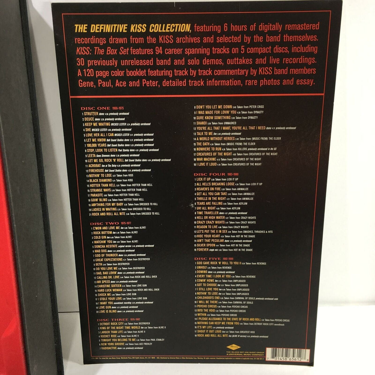 Detailed view of the back cover from the Definitive Kiss Collection 5 Disc Box Set showcasing the tracklist and features offered.