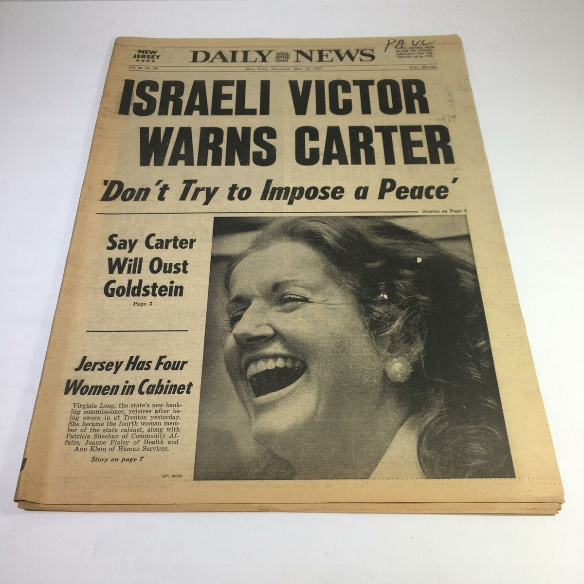 Front cover of the NY Daily News from May 21, 1977, featuring the headline 'Israeli Victor Warns Carter: Don't Try to Impose a Peace' along with the image of a woman laughing. The issue highlights significant political discourse of the late 1970s.