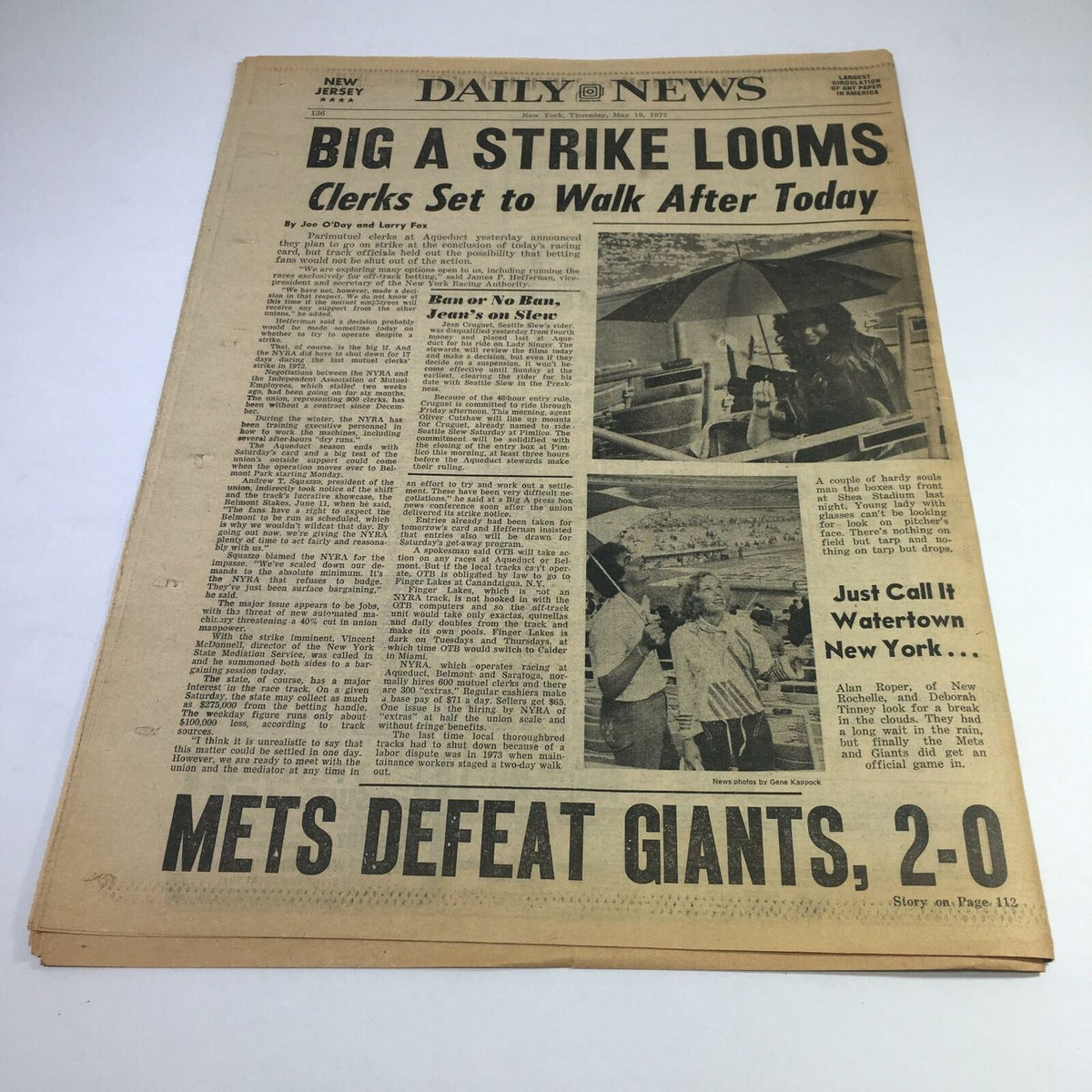 Front cover of the NY Daily News from May 21, 1977, with the headline 'Big A Strike Looms: Clerks Set to Walk After Today' discussing labor issues, alongside reports on the Mets defeating the Giants, showcasing historical journalism from the era.