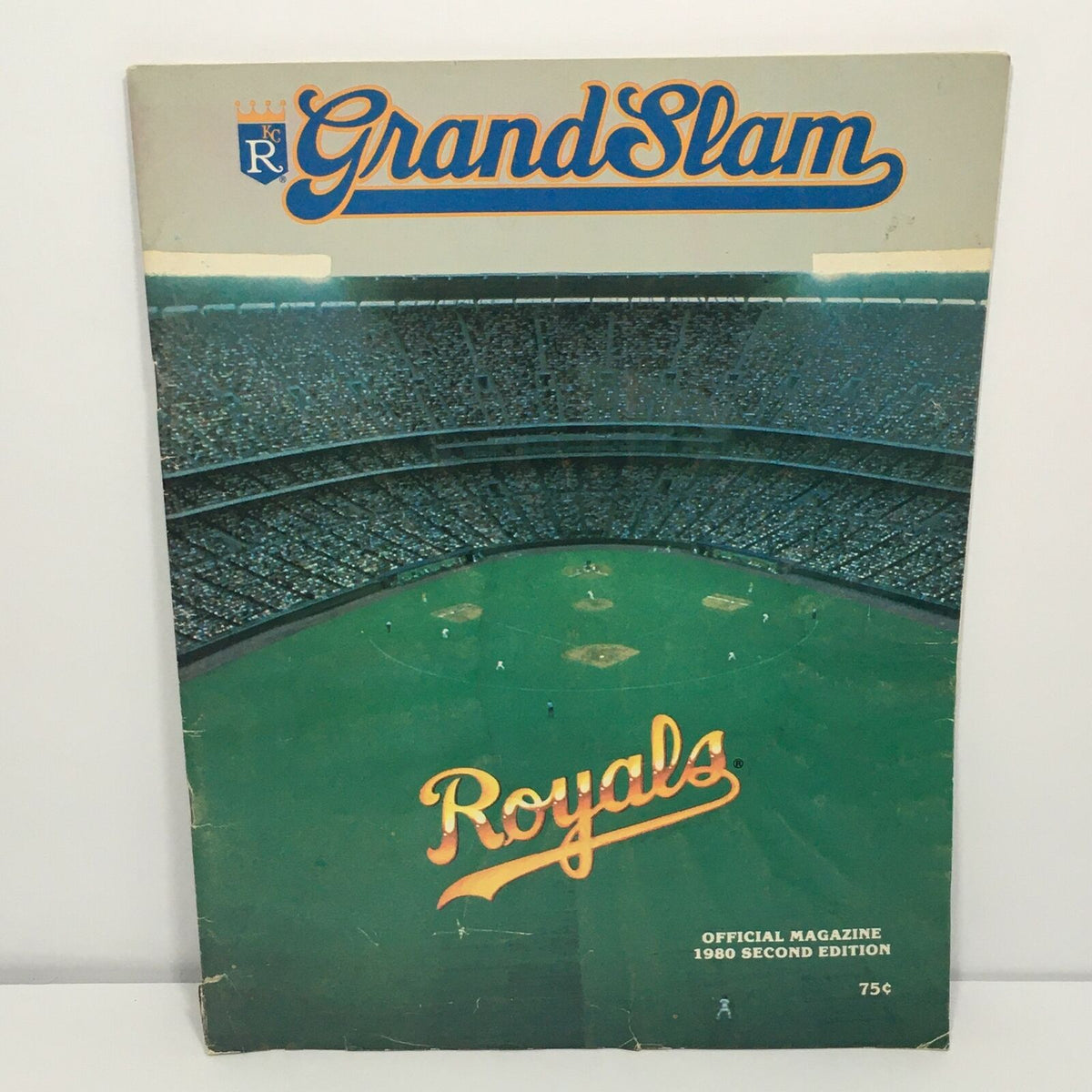 Cover of the Grand Slam Royals Official Magazine 1980 Second Edition showcasing a baseball stadium filled with fans and the title prominently displayed in blue and orange.