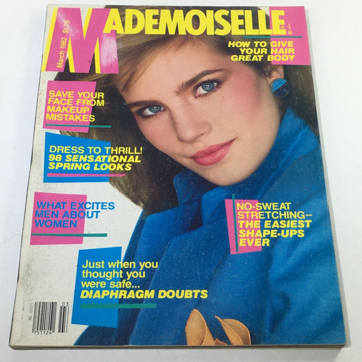 Front cover of VTG Mademoiselle Magazine: March 1982 featuring a model with blue eyes and blonde hair wearing a blue jacket. The cover includes vibrant text highlights about fashion and beauty tips, including articles on makeup mistakes, spring fashion looks, and fitness tips, highlighting the charm of the early 1980s.