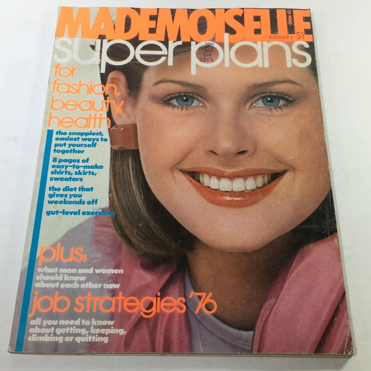 Cover of VTG Mademoiselle Magazine: February 1976 featuring a smiling model with blue eyes and bold fashion text highlighting topics on beauty, health, and job strategies.