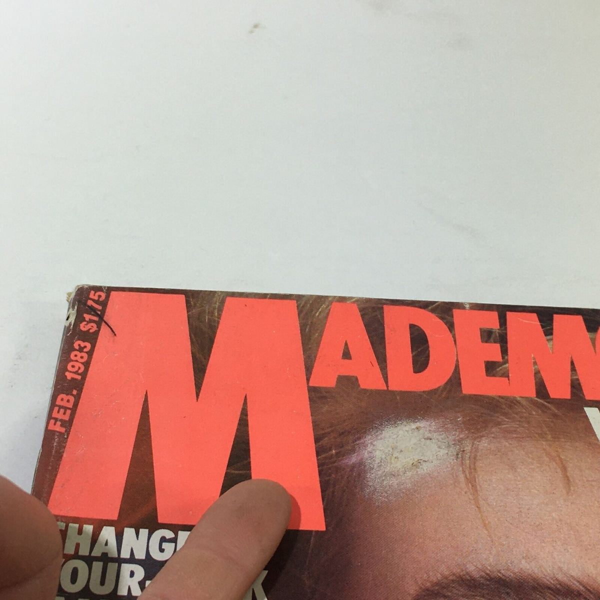 Detail of the top area of the VTG Mademoiselle Magazine, February 1983 cover showcasing the magazine title and month with visible wear and tear.