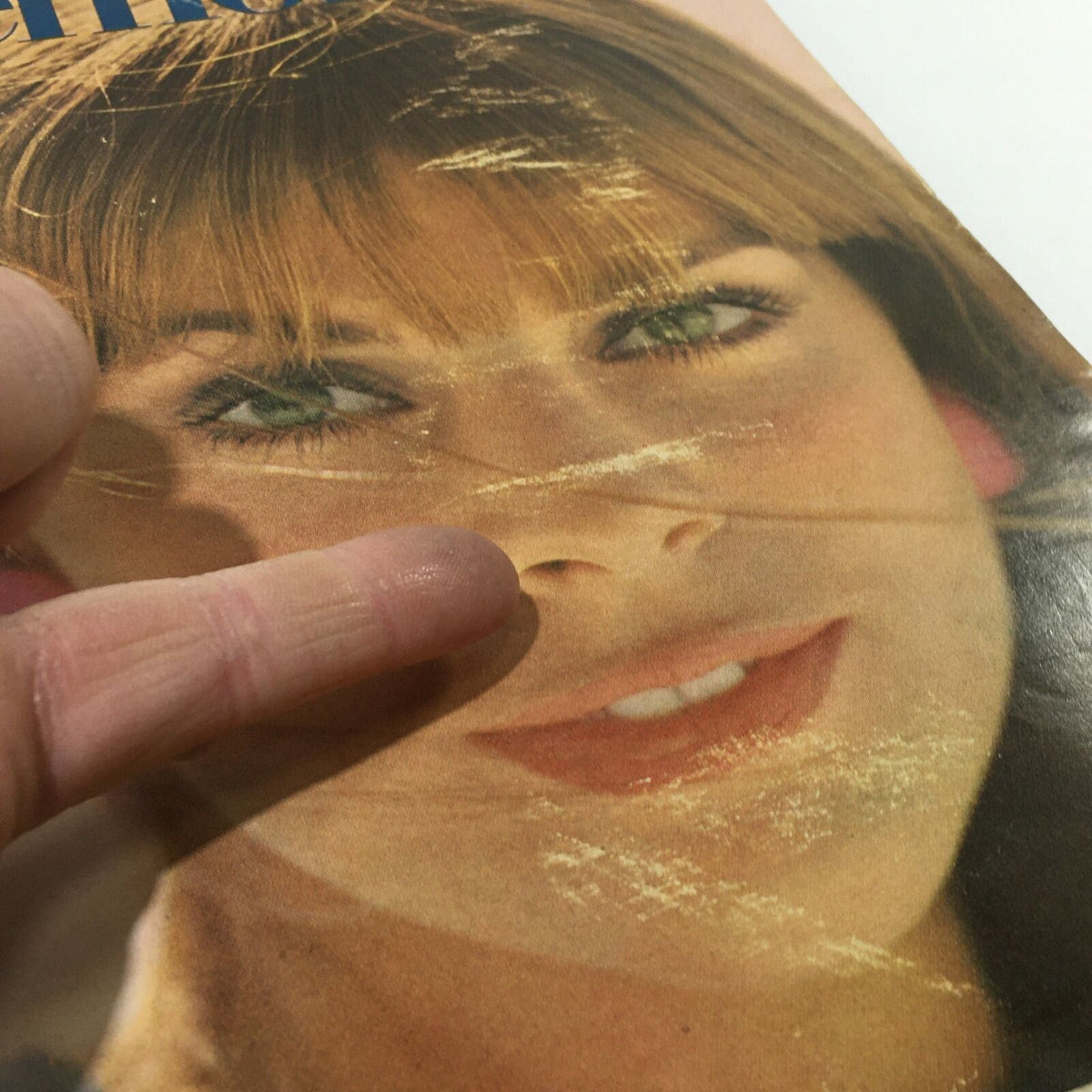 Another close-up of the cover of the VTG Mademoiselle Magazine: April 1967 College Beauty Fashion Issue highlighting the young woman's striking eyes and smile.