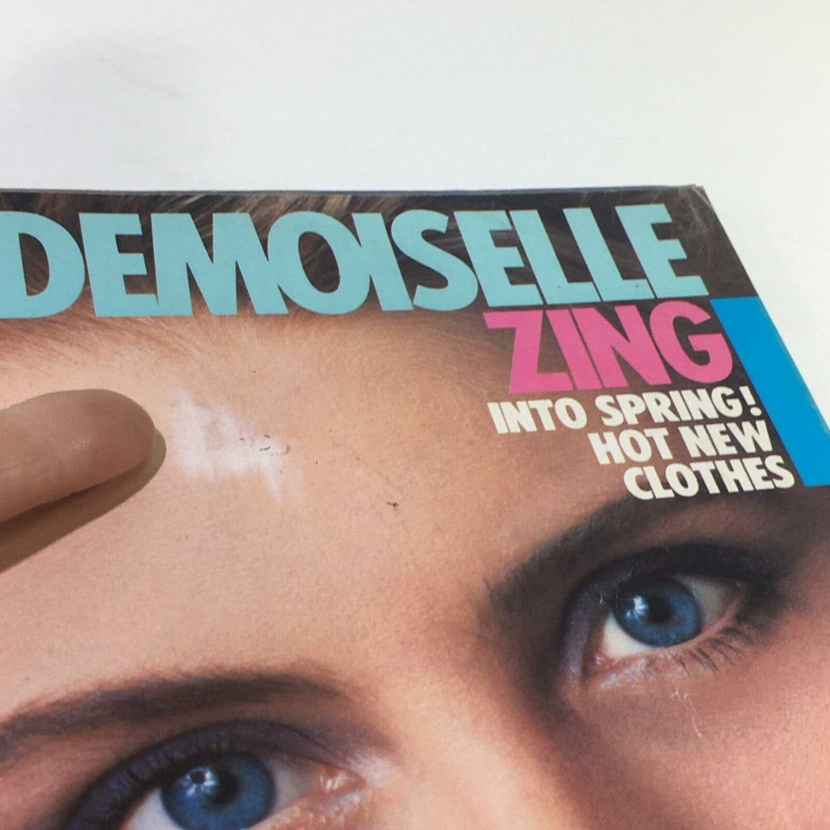 Close-up view of Mademoiselle Magazine March 1983 cover with Kim Alexis, highlighting the vibrant title and details of the features inside.