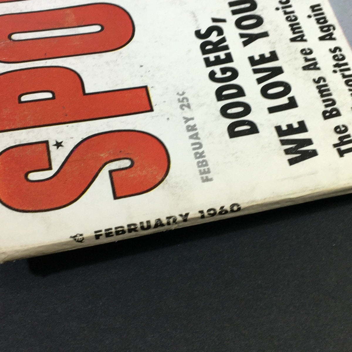 Close-up of the spine of the VTG Sport Magazine February 1960, showcasing the publication date and vintage design.
