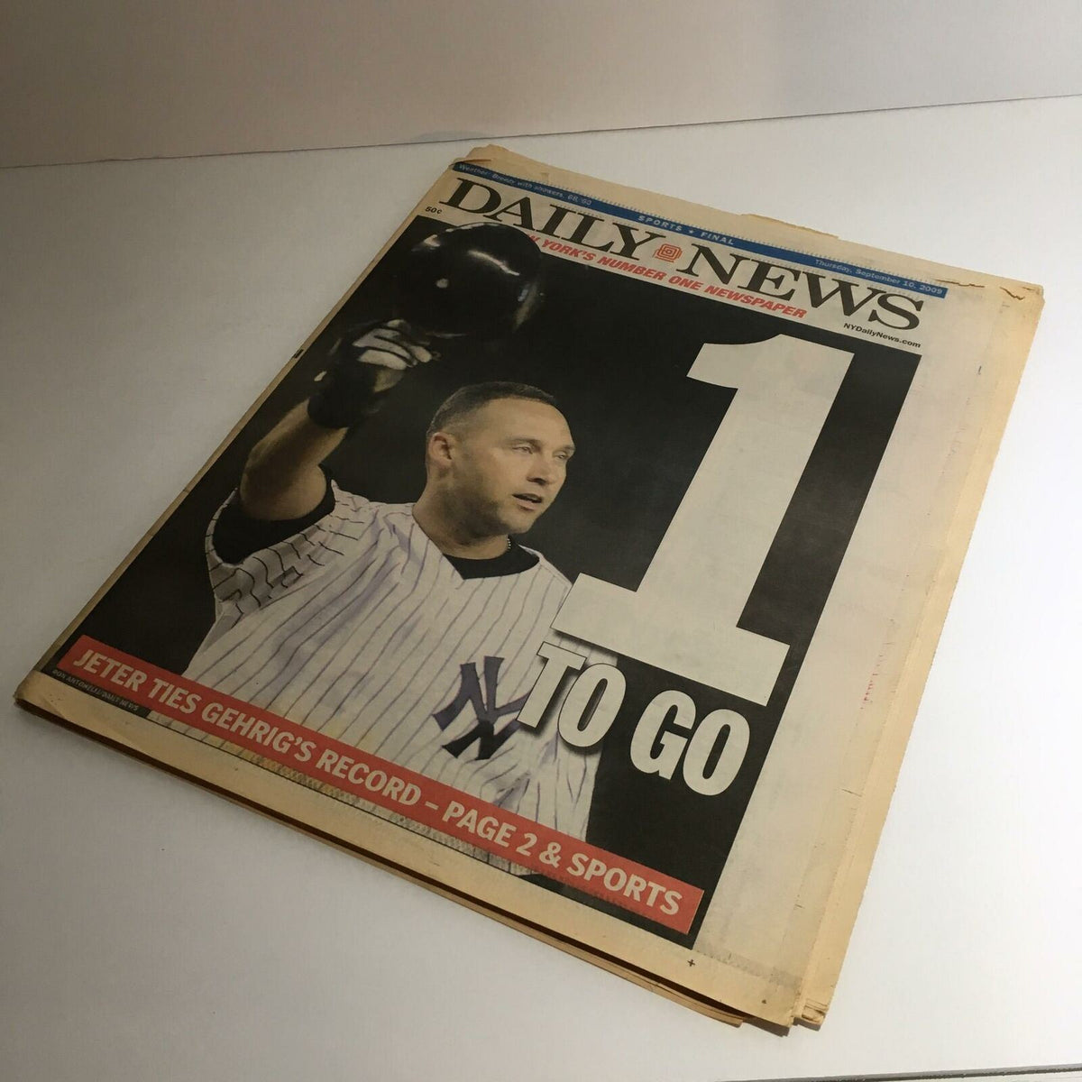 NY Daily News front page from September 10, 2009, showcasing the headline '1 TO GO' with an image of Derek Jeter, highlighting his achievement of tying Gehrig's record.