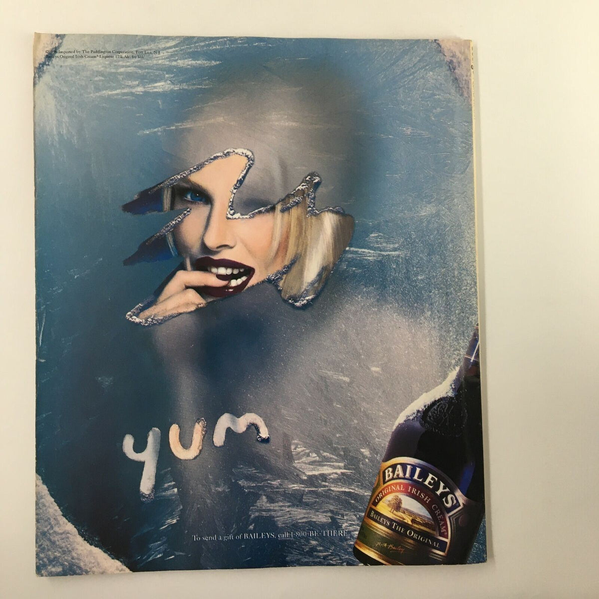 An advertisement page from George Magazine February 1997, displaying a stylish model promoting Baileys, showcasing the blend of culture and consumerism during this era.