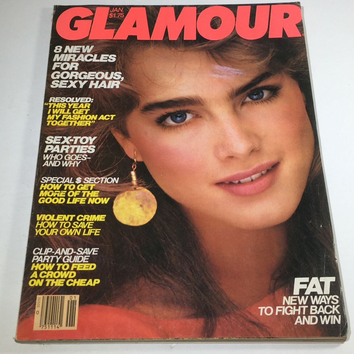 Cover of VTG Glamour Magazine: January 1982 featuring Brooke Shields with striking blue eyes, wearing a large earring, highlighting 80s fashion and culture.