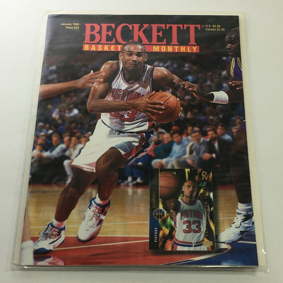 Beckett Basketball Monthly: January 1995 Issue #54 featuring Pistons player Grant Hill on the cover, showcasing him in action with a basketball.