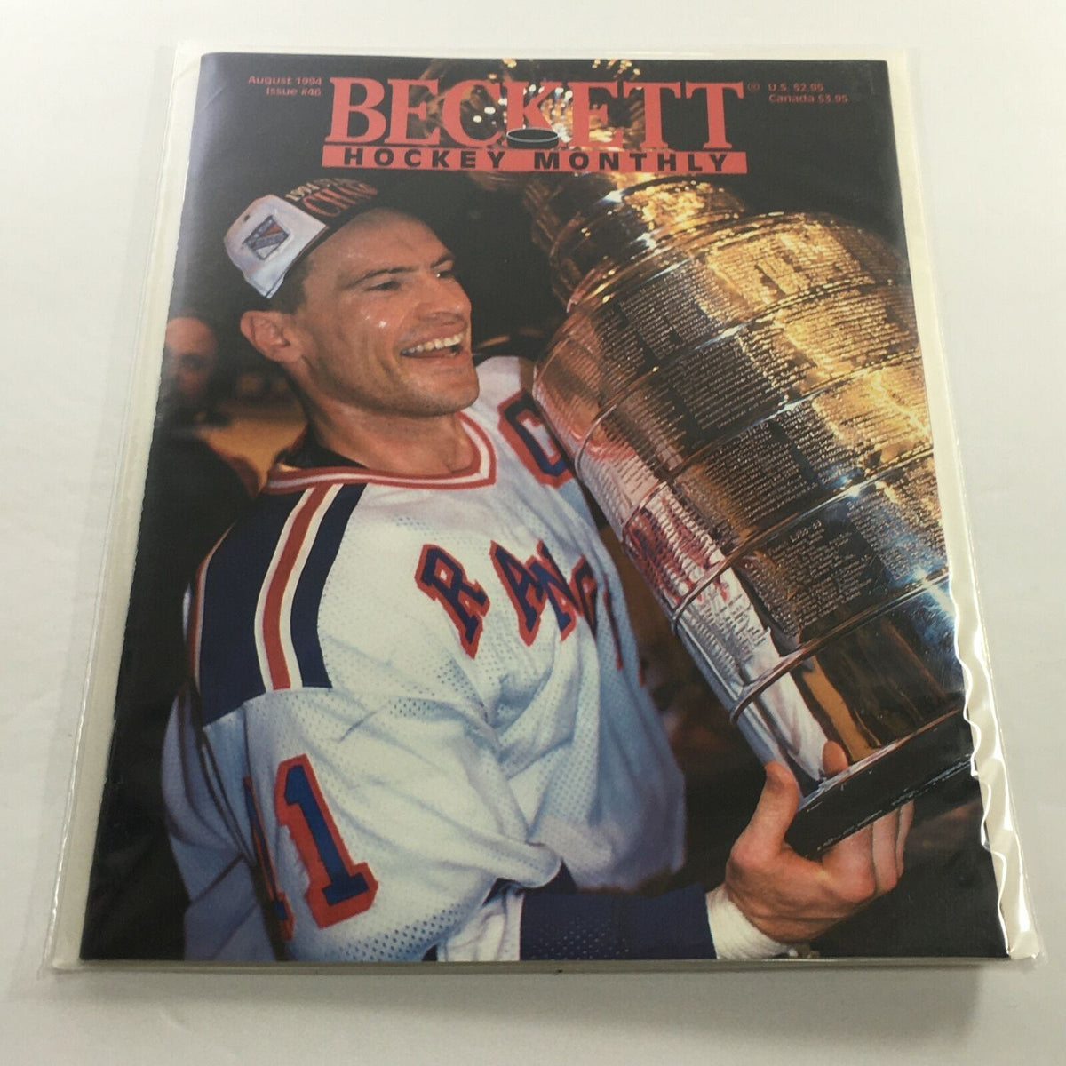 Beckett Hockey Monthly: August 1994 Issue #46 featuring a jubilant Mark Meisser holding the Stanley Cup, showcasing excellent condition and preserved in plastic.