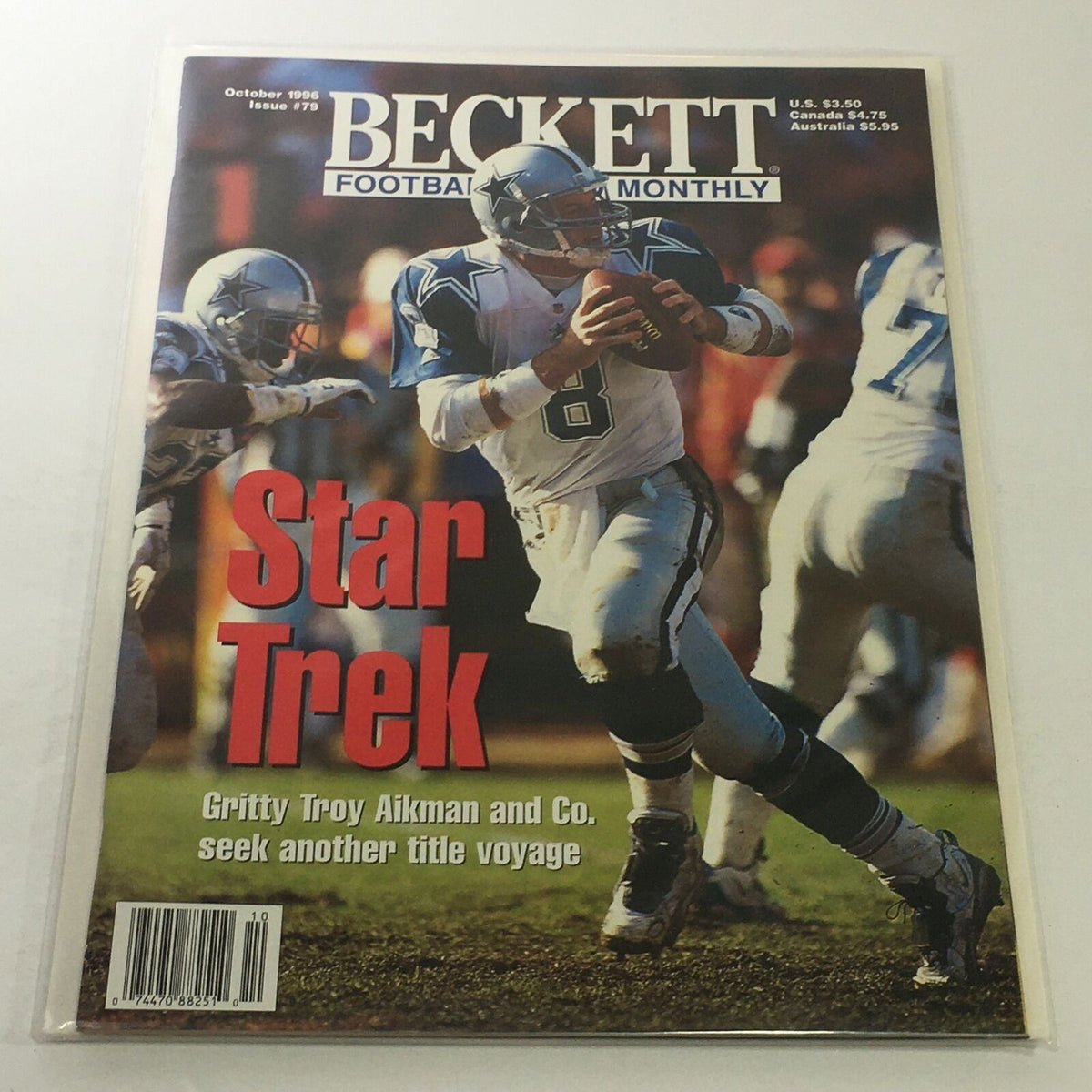 Beckett Football Card Monthly: October 1996 Issue #79 featuring Gritty Troy Aikman on the cover, showcasing a prominent image of Aikman in action with a football in hand.