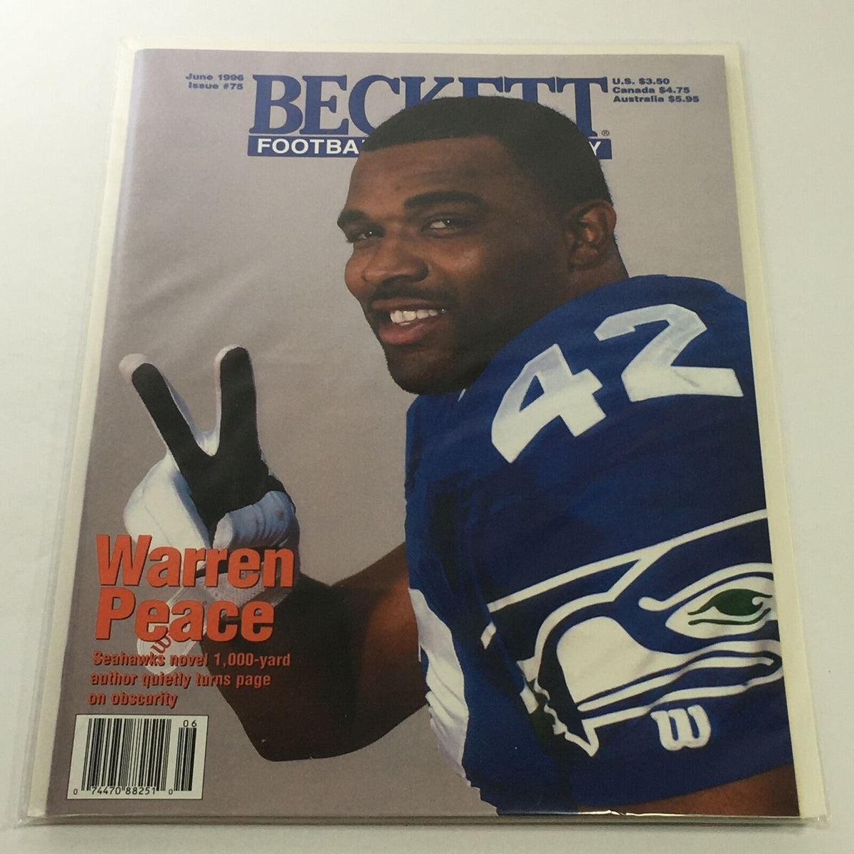 Beckett Football Card Monthly, June 1996 Issue #75 featuring Seahawks player Warren Peace, showcasing the magazine cover with Warren Peace making a peace sign.