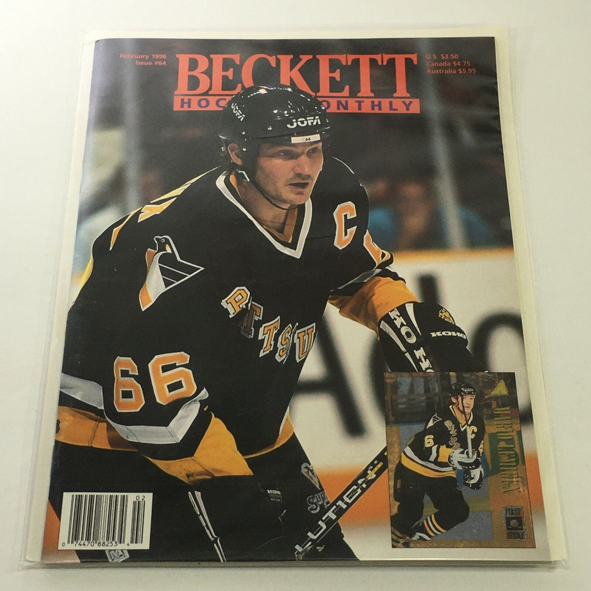 Beckett Hockey Monthly: February 1996 Issue #64 featuring Mario Lemieux on the cover, showcasing him in a black and gold hockey uniform on the ice.