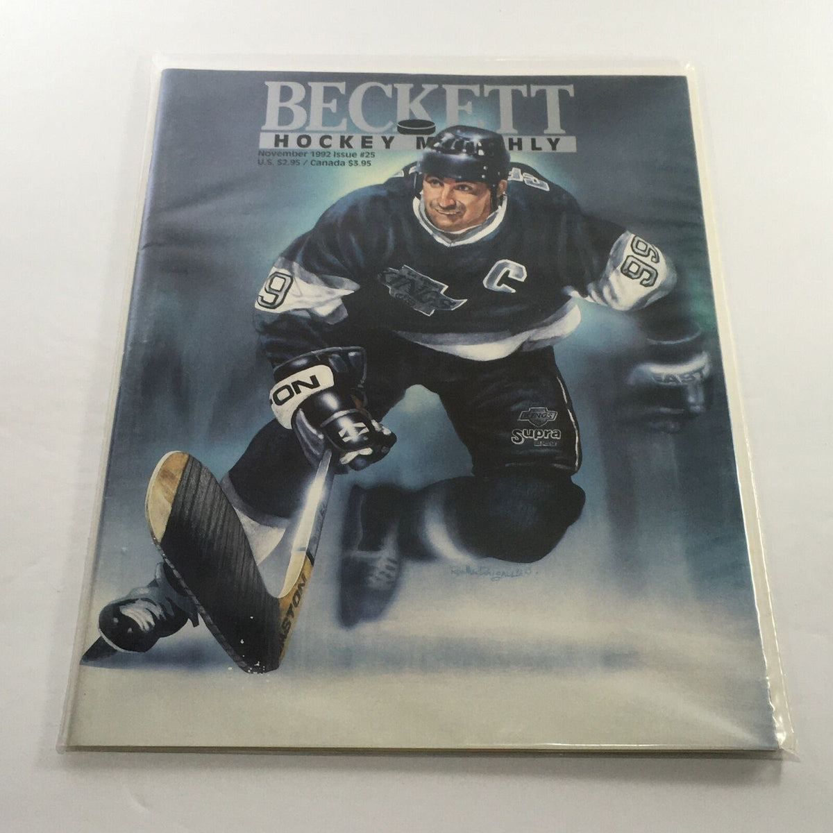 Beckett Hockey Monthly: November 1992 Issue #25 featuring a cover illustration of Wayne Gretzky, showcasing exceptional artwork and attention to detail. This magazine is in excellent condition, bagged and boarded for protection.