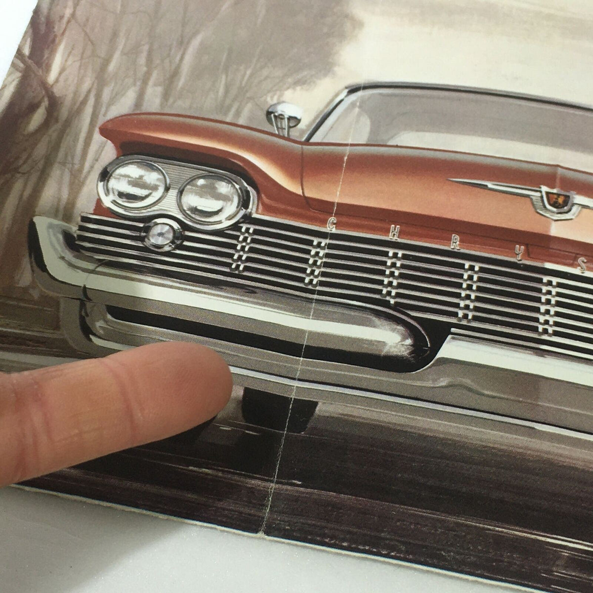 Detailed close-up of the grille and front design of the VTG 1959 Chrysler Windsor New Yorker Sedan Hardtop Car Auto Brochure Catalog.
