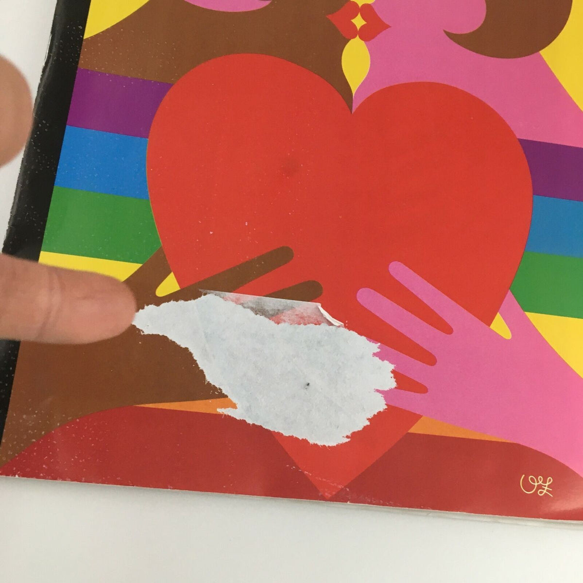 Close-up of The New Yorker June 24 2019 magazine cover by Olimpia Zagnoli, showing a detail of a white mark on the red heart design, highlighting signs of previous handling.