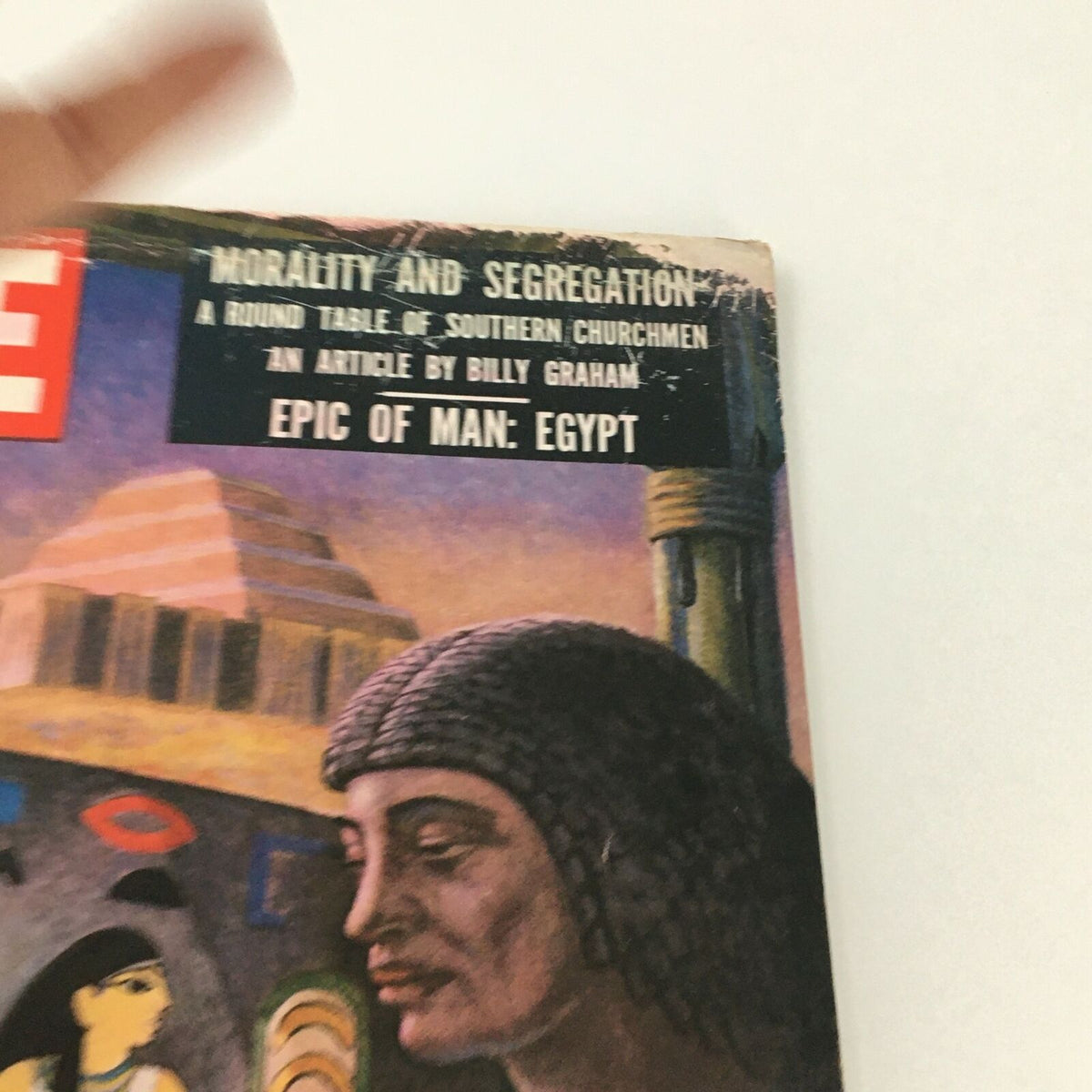 Detail view of the cover of VTG Life Magazine October 1 1956 that prominently features the headline 'Epic of Man: Egypt.' The cover art includes an Egyptian artist and thematic elements symbolizing ancient Egyptian civilization.