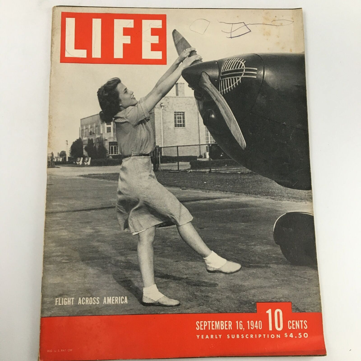 Front cover of VTG Life Magazine from September 16, 1940, featuring the theme 'Flight Across America.' A woman is seen working on an airplane propeller, showcasing a moment in aviation history.