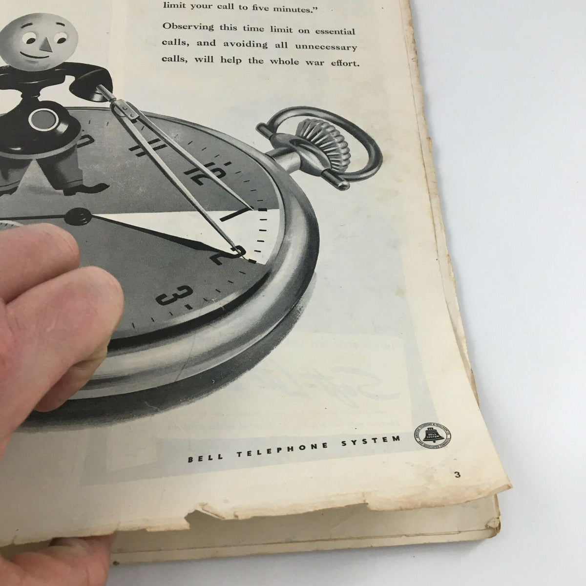 Interior page of VTG Life Magazine November 8 1943 displaying an advertisement with a vintage stopwatch and character urging limited call times during wartime.