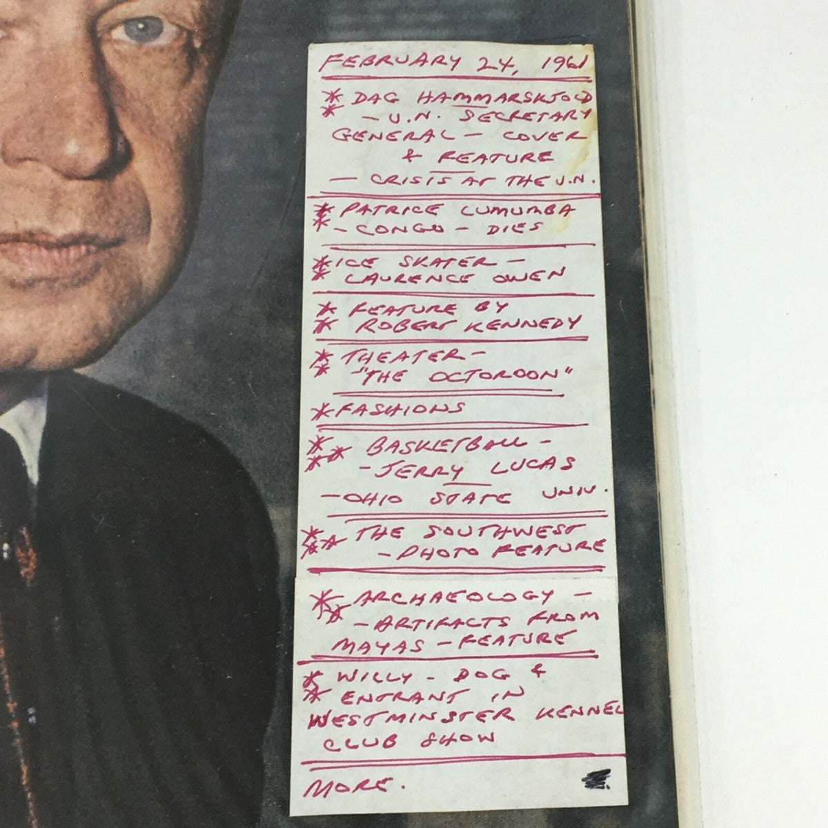 Close-up of handwritten content from VTG Life Magazine February 24 1961, detailing featured articles including Dag Hammarskjöld and various cultural highlights.