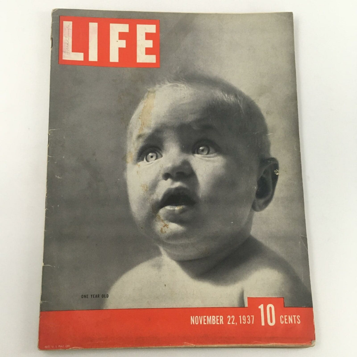 Cover of VTG Life Magazine November 22, 1937 featuring a classic black and white portrait of a baby with striking blue eyes, celebrating one year on the newsstand.