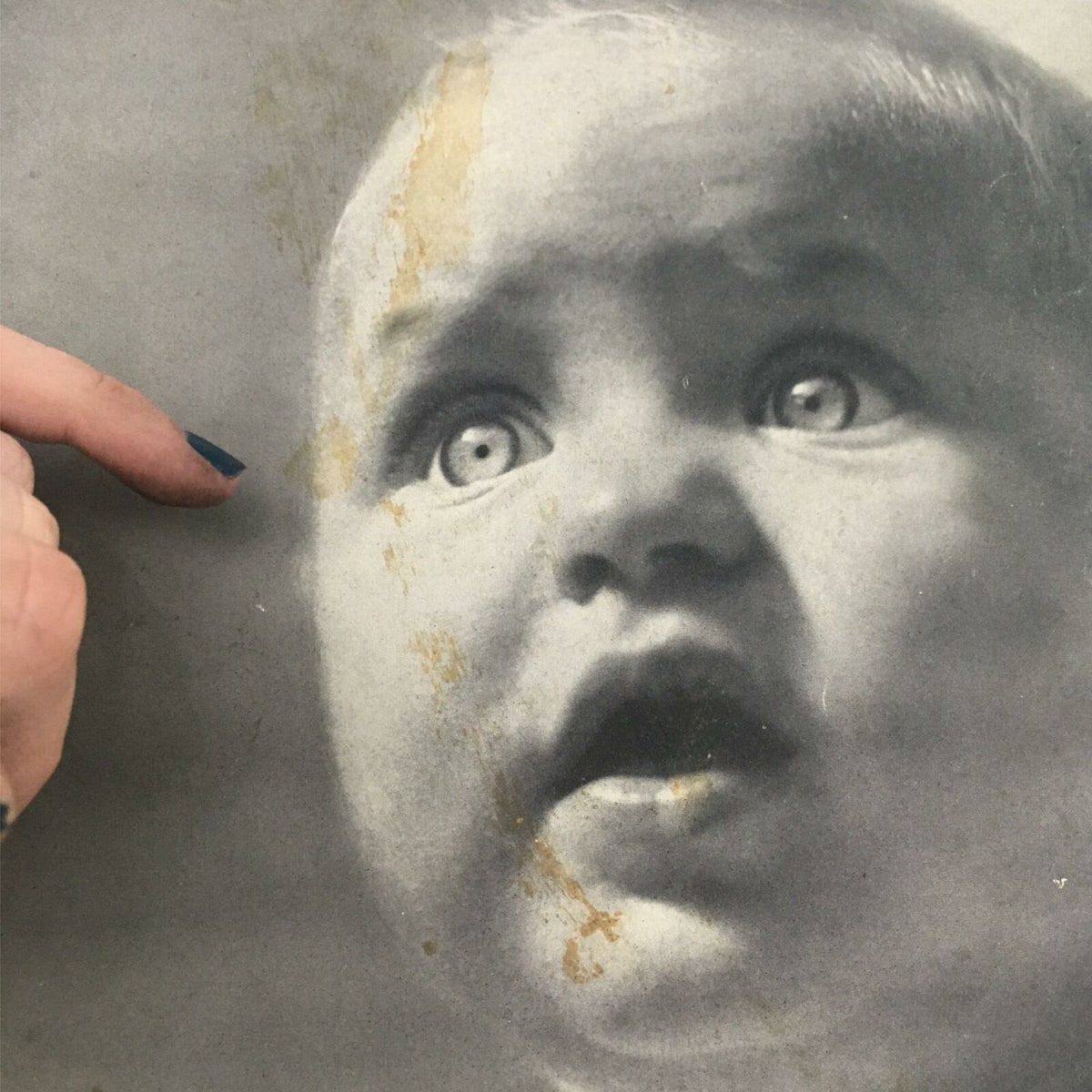 Close-up detail of the cover of VTG Life Magazine November 22, 1937, highlighting the expression of a baby with blue eyes and notable wear from age.