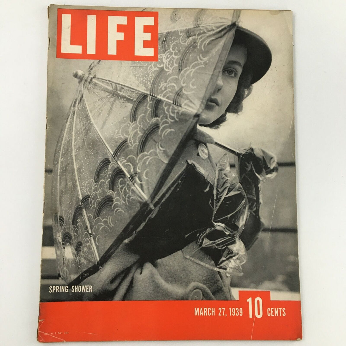 VTG Life Magazine from March 27, 1939, featuring the Spring Shower cover with a stylishly dressed woman holding an umbrella, showcasing vintage fashion and historical charm.