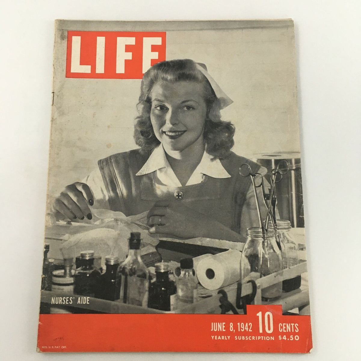 VTG Life Magazine June 8 1942 featuring a Nurses' Aide, showcasing a nurse smiling while working at her station surrounded by medical supplies. This vintage magazine cover reflects wartime healthcare.