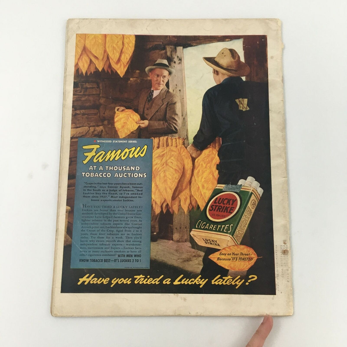 Back cover of vintage LIFE Magazine from July 24, 1939 featuring an advertisement for Lucky Strike cigarettes with people at a tobacco auction.